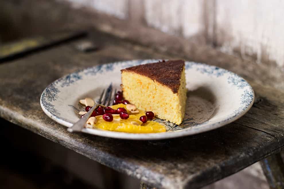 Clementine cake with an orange and pomegranate salad from Recipes From The Farm (Andrew Montgomery/PA)