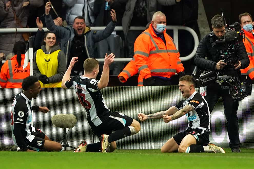 Newcastle’s Kieran Trippier (right) celebrates scoring his side’s third goal against Everton (Owen Humphreys/PA)