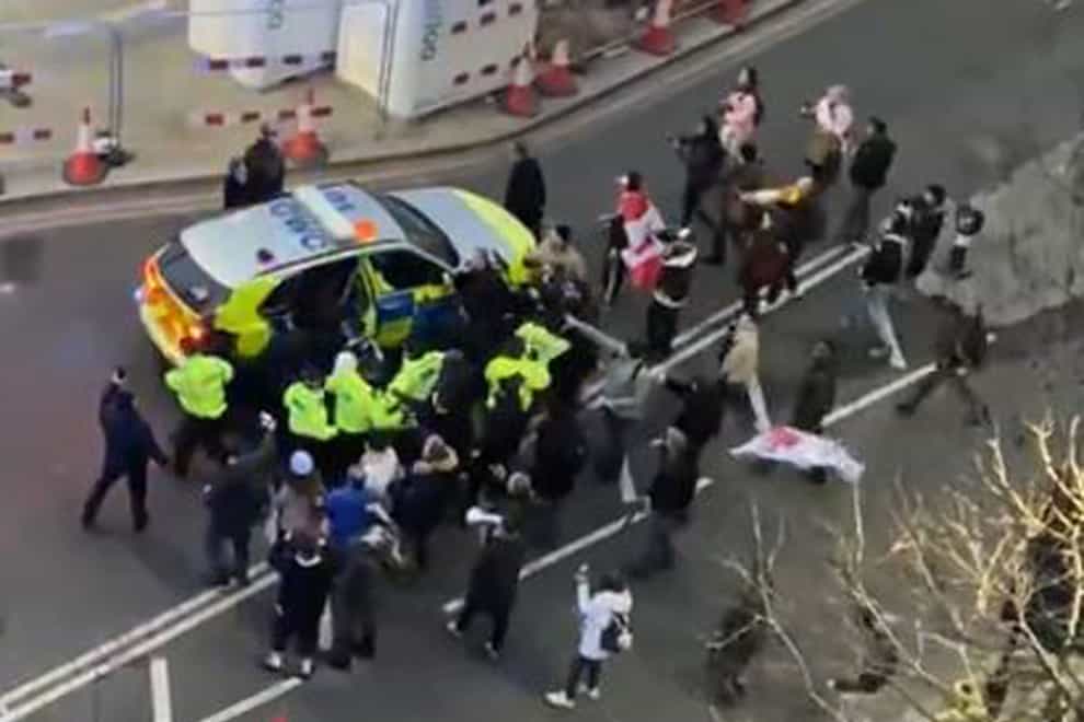 Police and protesters in Westminster clashed as officers used a police vehicle to escort Labour leader Sir Keir Starmer to safety (Conor Noon/PA/screen grab)