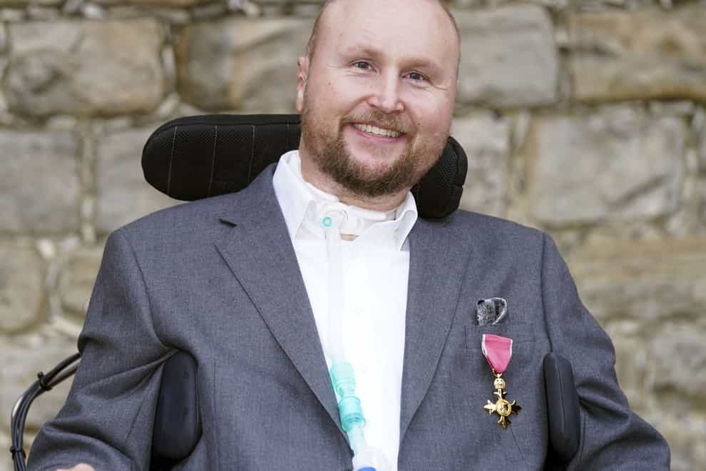 Matthew Hampson with his OBE following an investiture ceremony at Windsor Castle (Steve Parsons/PA)
