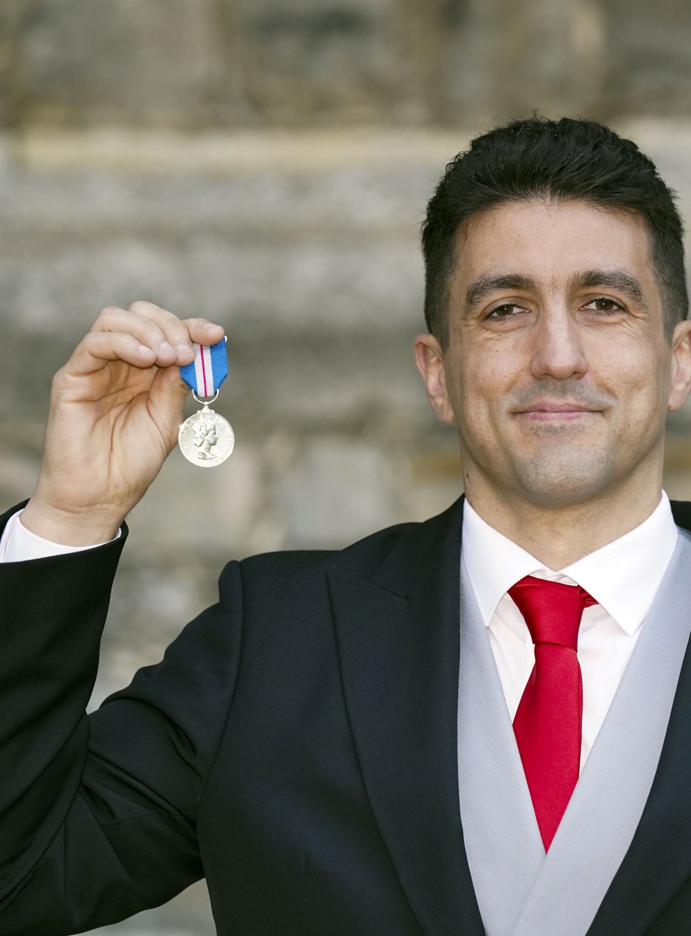 Joel Snarr his Queen’s Gallantry Medal following an investiture ceremony (Steve Parsons/PA)