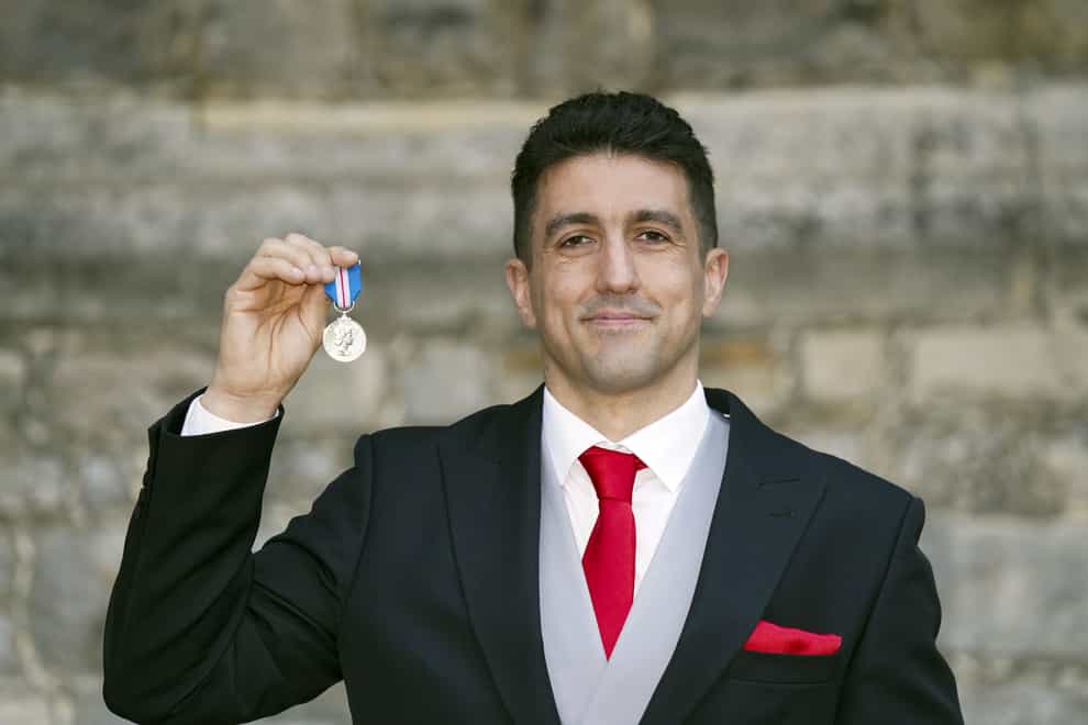 Joel Snarr his Queen’s Gallantry Medal following an investiture ceremony (Steve Parsons/PA)