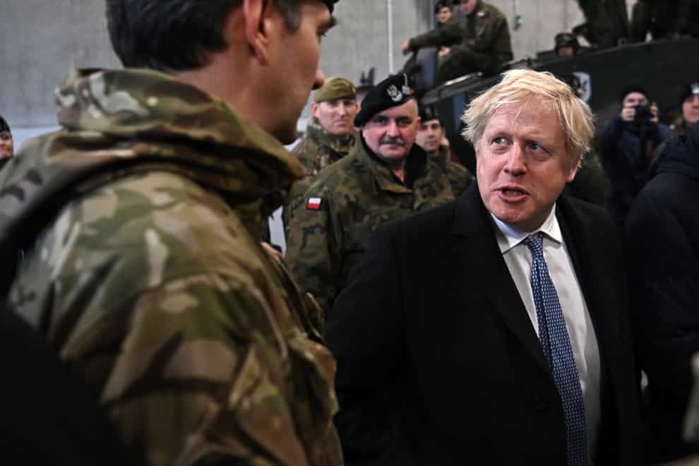 Boris Johnson speaks with British troops in Poland (Daniel Leal/PA)