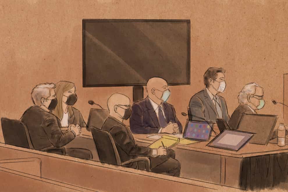 A court sketch, from left, of former Minneapolis police officer Tou Thao, lawyer Robert Paule, lawyer Natalie Paule, lawyer Tom Plunkett, former Minneapolis police officer J. Alexander Kueng, former officer Thomas Lane and lawyer Earl Gray (Cedric Hohnstadt via AP)