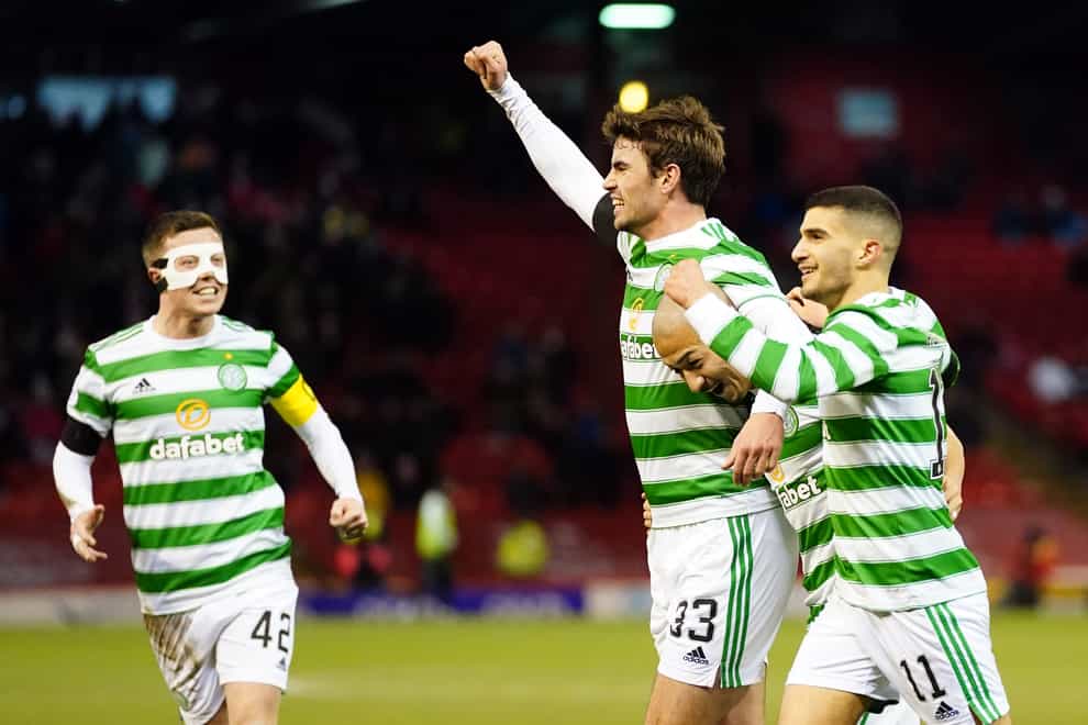 Matt O’Riley (arm raised) celebrates his first Celtic goal (Jane Barlow/PA)