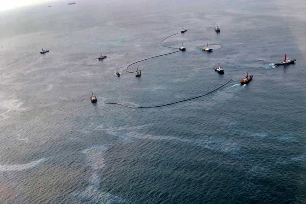 An aerial view from a navy plane shows clean-up efforts off the coast of Rayong on Friday February 11 2022 (Royal Thai Navy via AP)