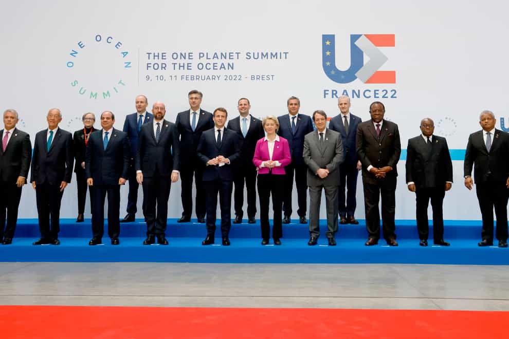 France’s President Emmanuel Macron, centre, poses with heads of states for a picture before the Hight Level Segment session of the One Ocean Summit, in Brest, Brittany, on Friday February 11 2022 (Ludovic Marin via AP)