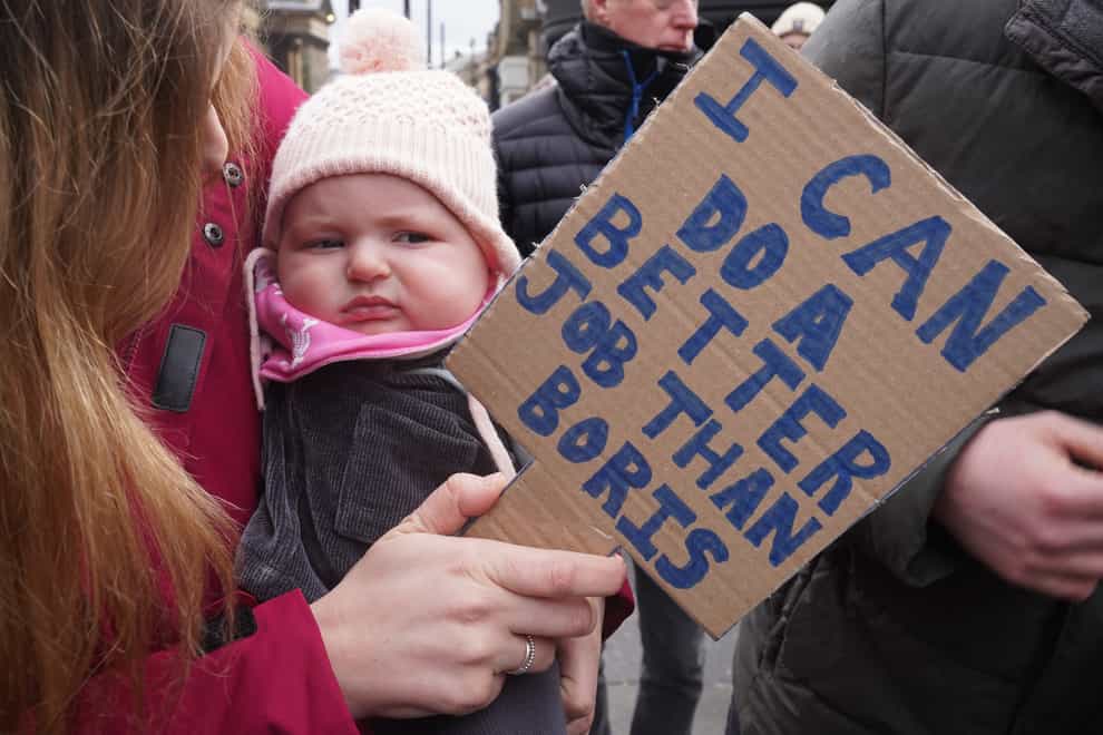 Three-month-old Jocelyn Wilczek joins people in Newcastle taking part in the People’s Assembly nationwide protest about cost of living crisis (Owen Humphreys/PA)