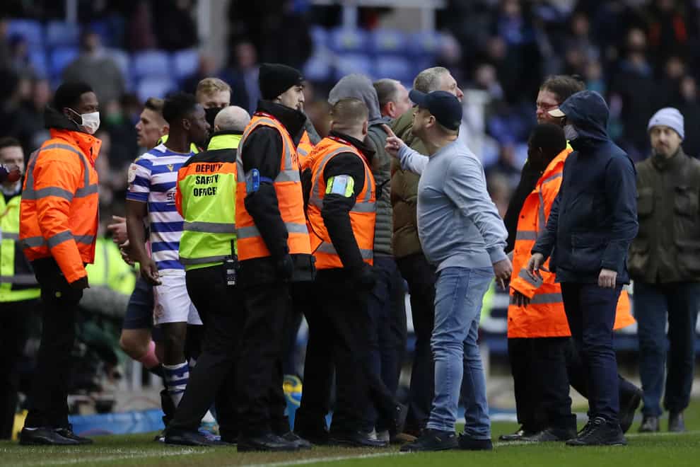 Reading fans storm the pitch after the final whistle (Bradley Collyer/PA)