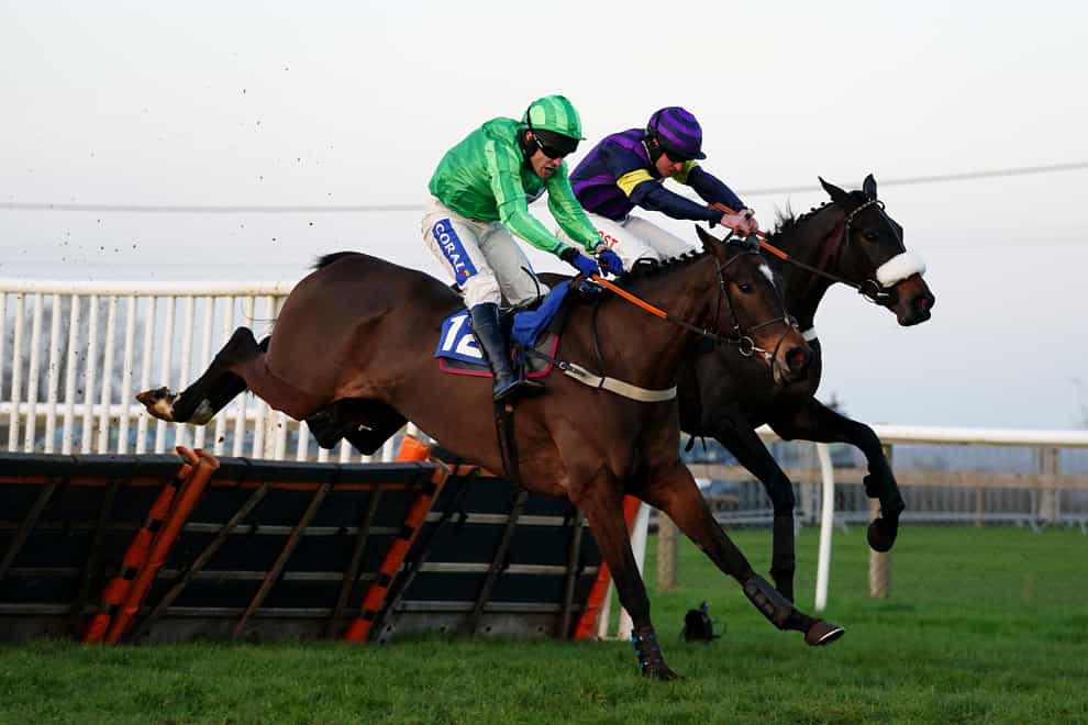 Abuffalosoldier ridden by jockey Henry Brooke (right) on their way to winning the Racing TV Profits Returned To Racing Novices’ Hurdle (David Davies/PA)