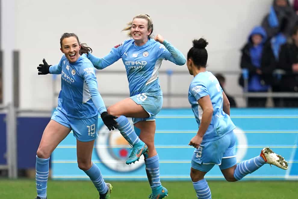 Manchester City’s Caroline Weir, left, celebrates her derby winner with her team-mates (Nick Potts/PA)