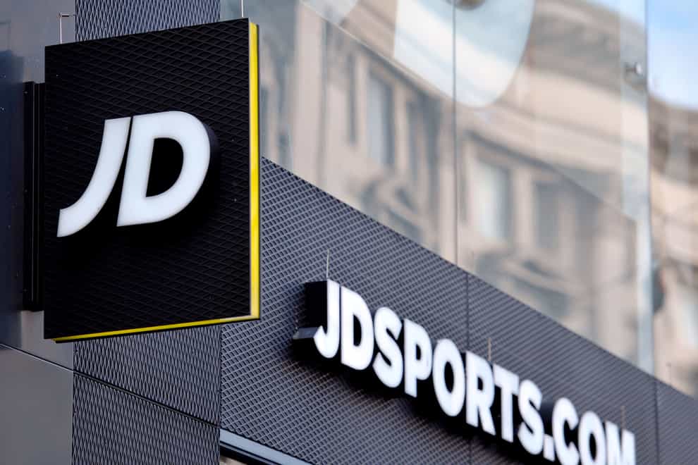 A shop sign for JD Sports in central London. The UK competition regulator has fined JD Sports and Footasylum almost £5m over breaking merger rules (Nick Ansell/PA)
