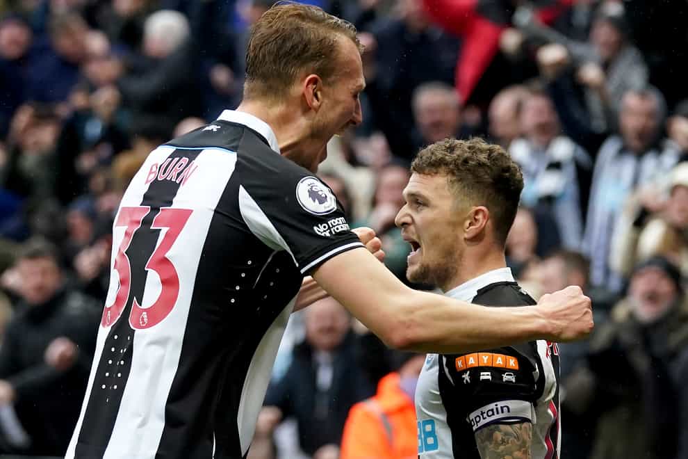 Newcastle defender Dan Burn (left) congratulates team-mate Kieran Trippier after his winning goal against Aston Villa (Owen Humphreys/PA)