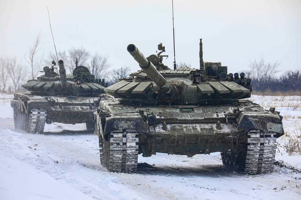 Russian tanks roll on the field during military drills in Leningrad region (AP)