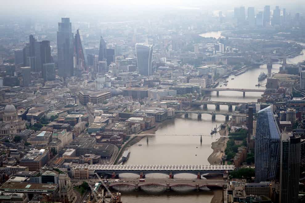 An aerial view of the River Thames in central London alongside the City of London and Canary Wharf financial districts. Picture date: Friday July 9, 2021.