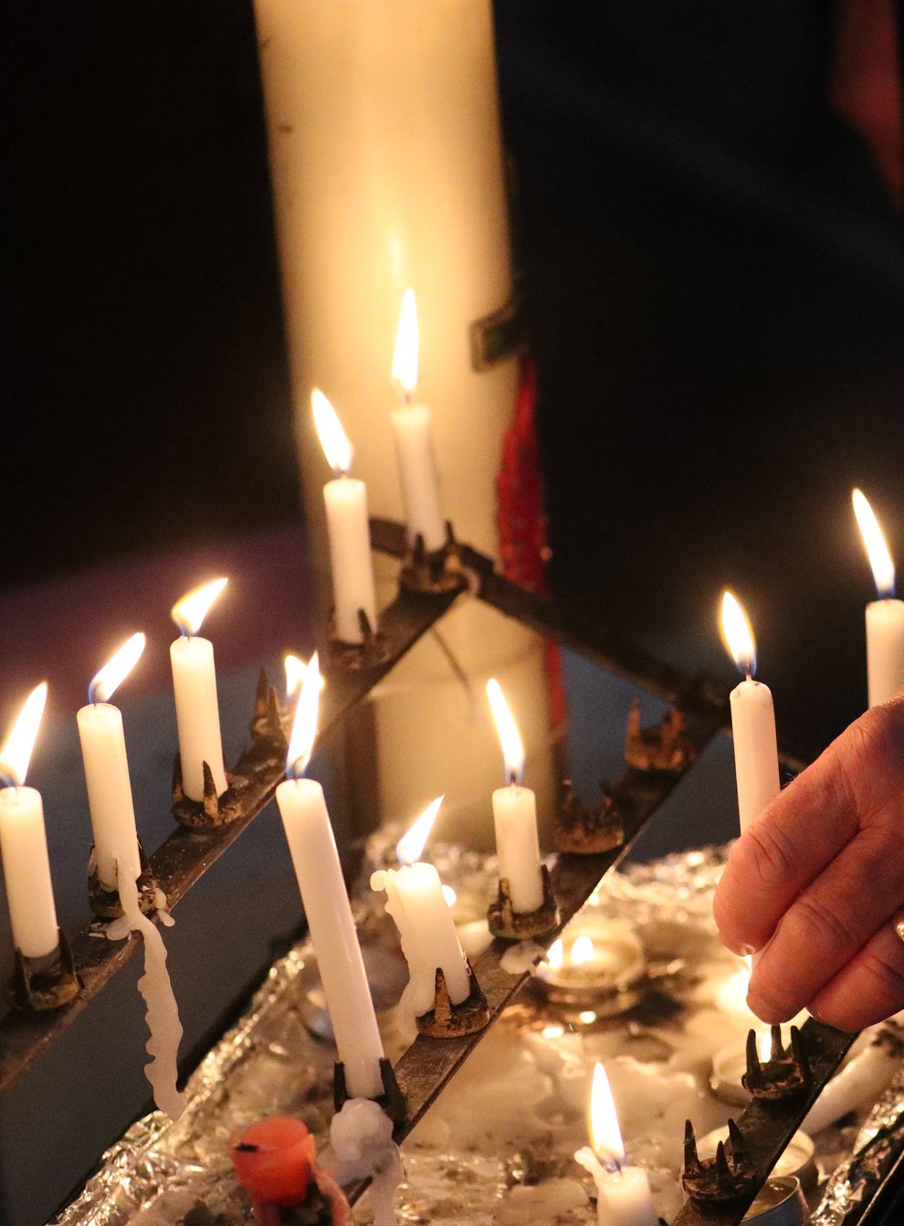 Lit candles in a church. File image (Steve Parsons/PA)