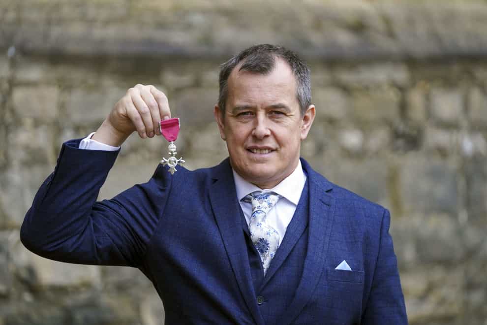 John McGuinness with his MBE for services to motorcycle racing following an investiture ceremony by the Princess Royal at Windsor Castle (Steve Parsons/PA)