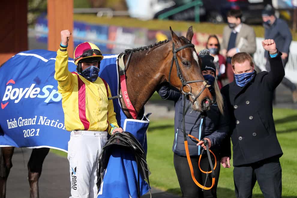 Jockey Ricky Doyle and trainer Dermot A McLoughlin celebrate after Freewheelin Dylan won The BoyleSports Irish Grand National Chase during the 2021 Fairyhouse Easter Festival at the Fairyhouse racecourse, Ireland. Picture date: Monday April 5, 2021 (Niall Carson/PA)