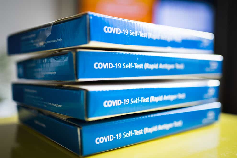 Boxes of NHS Covid-19 rapid antigen test kits (Jane Barlow/PA)