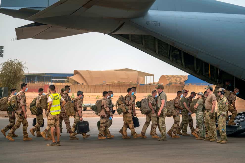 French troops board a US Air Force C130 transport plane in Gao, Mali (Jerome Delay/AP)