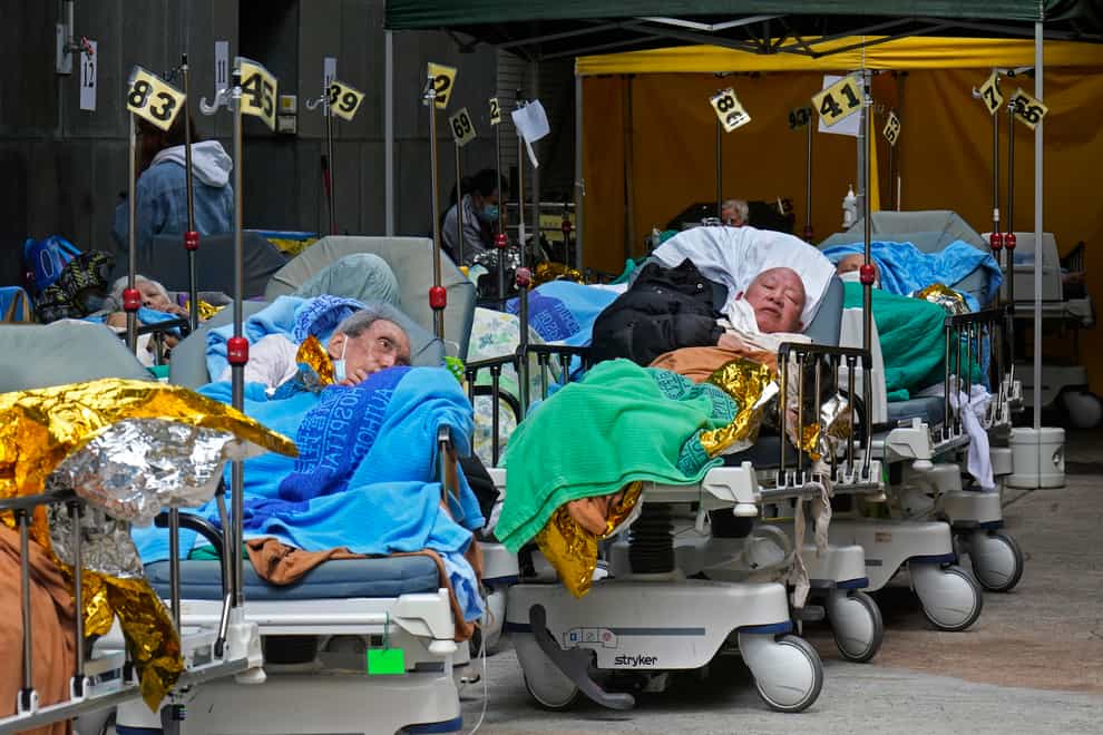 Hong Kong hospitals are becoming overwhelmed by the latest Covid surge (Vincent Yu/AP)