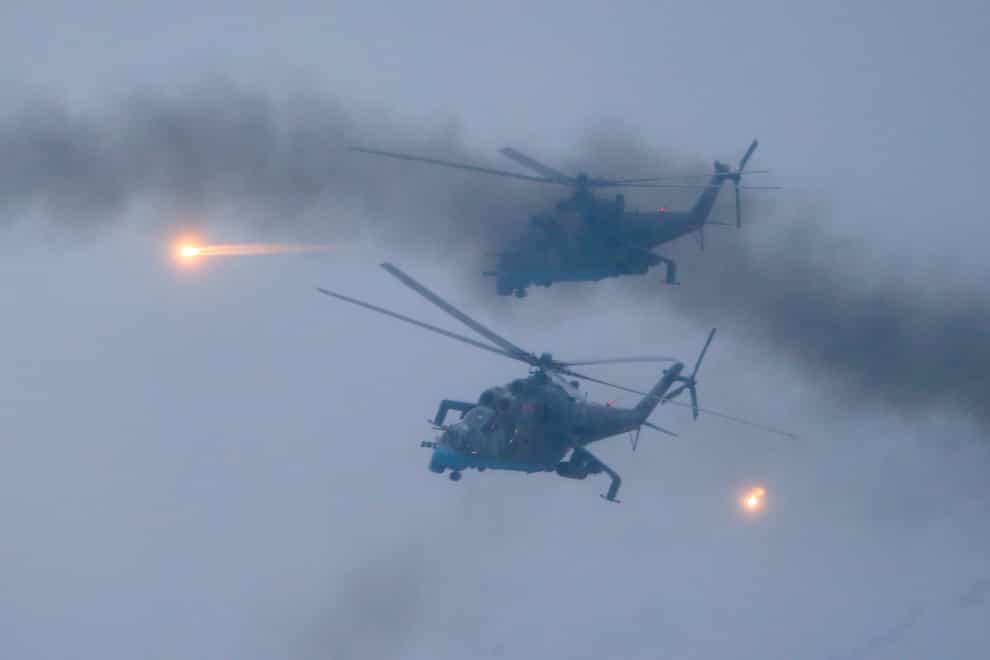 Military helicopters fly over the Osipovichi training ground during the Union Courage-2022 Russia-Belarus military drills near Osipovichi , Belarus (AP)