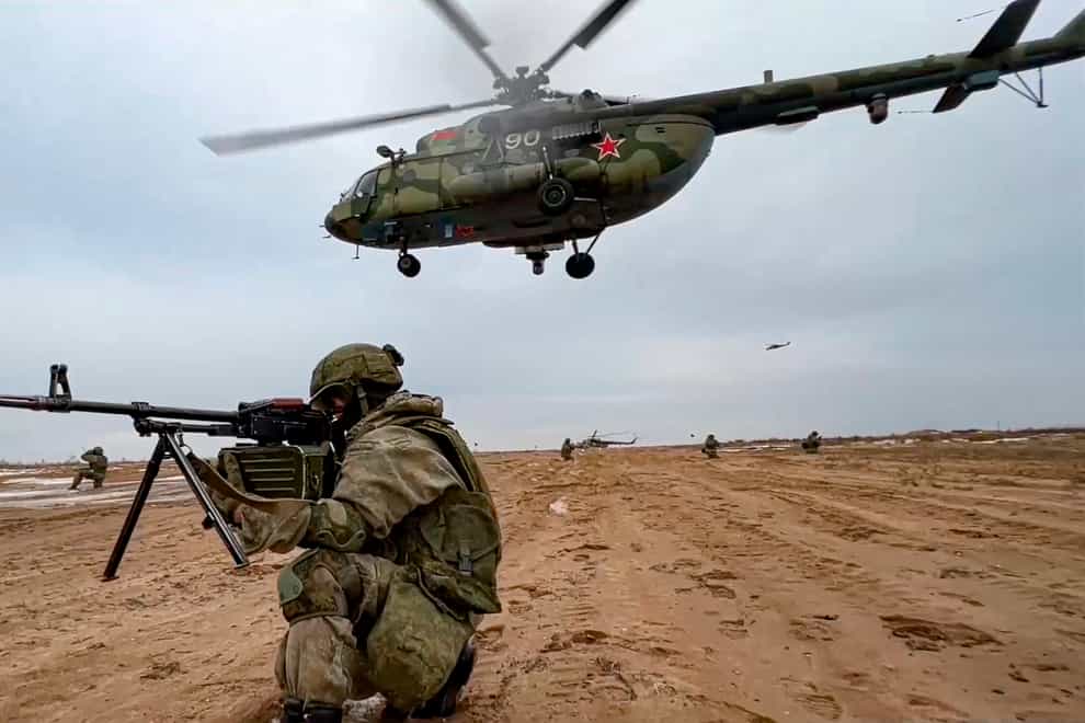 Russian marines take their position during the Union Courage-2022 Russia-Belarus military drills at the Obuz-Lesnovsky training ground in Belarus (Russian Defence Ministry Press Service via AP)