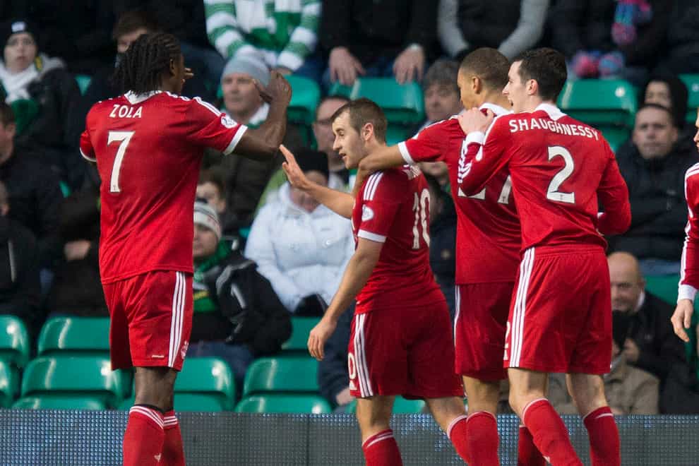 Niall McGinn celebrates a goal for Aberdeen at Celtic Park (Jeff Holmes/PA)