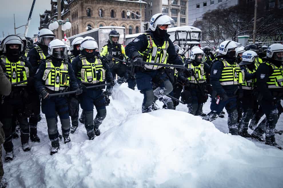 Police move in to clear protesters (Robert Bumsted/AP)