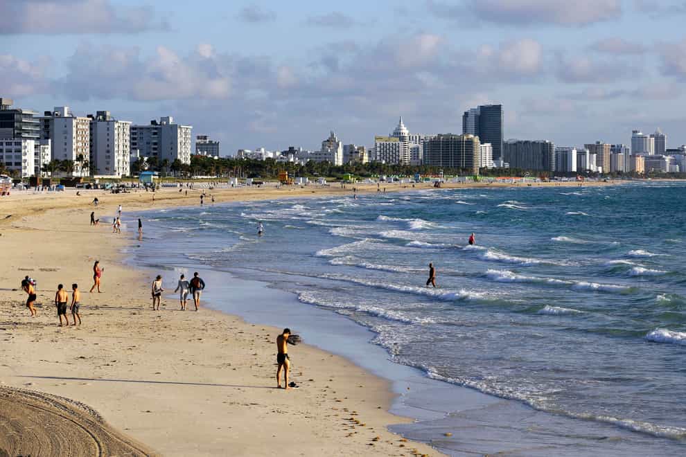 The helicopter crashed off South Beach (Lynne Sladky/AP)