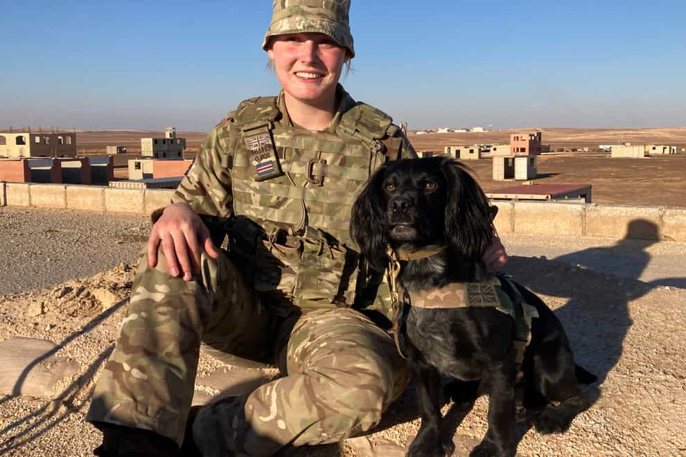 Molly Shaw of the Royal Army Veterinary Corps with service animal Ace (Rebecca Black/PA)