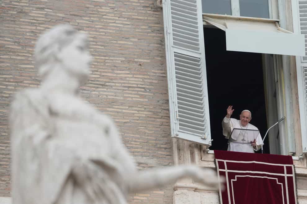 The Pope addresses a crowd from a balcony above St Peter’s Square (AP Photo/Gregorio Borgia)
