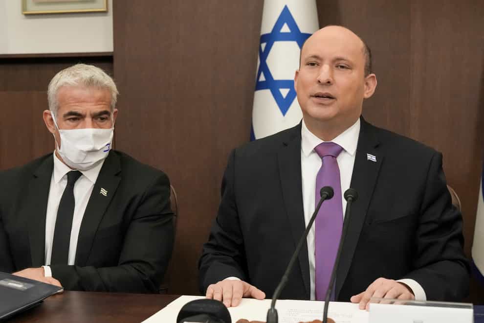 Prime Minister Naftali Bennett (right) said unvaccinated tourists will be allowed to enter Israel (AP Photo/Tsafrir Abayov)