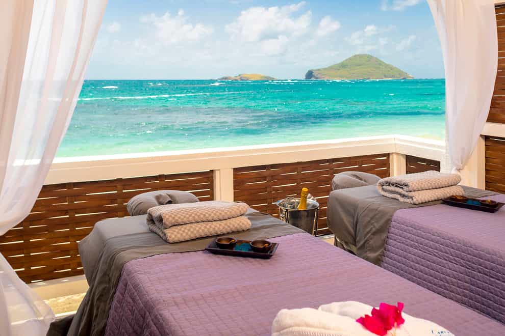 The oceanfront cabanas at the Sanctuary spa offer deep relaxation to the sound of the sea (Coconut Bay/PA)