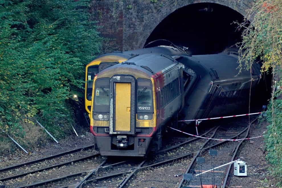 Crushed leaves suspected of causing a crash between two passenger trains were not cleared because of engineering work, an investigation has found (Steve Parsons/PA)