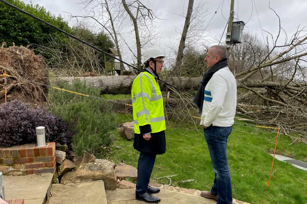 David Thomas (right), a resident of Oldbury, Ightham in Kent, with Energy minister Greg Hands after his home got cut off from the power grid (Sophie Wingate/PA)