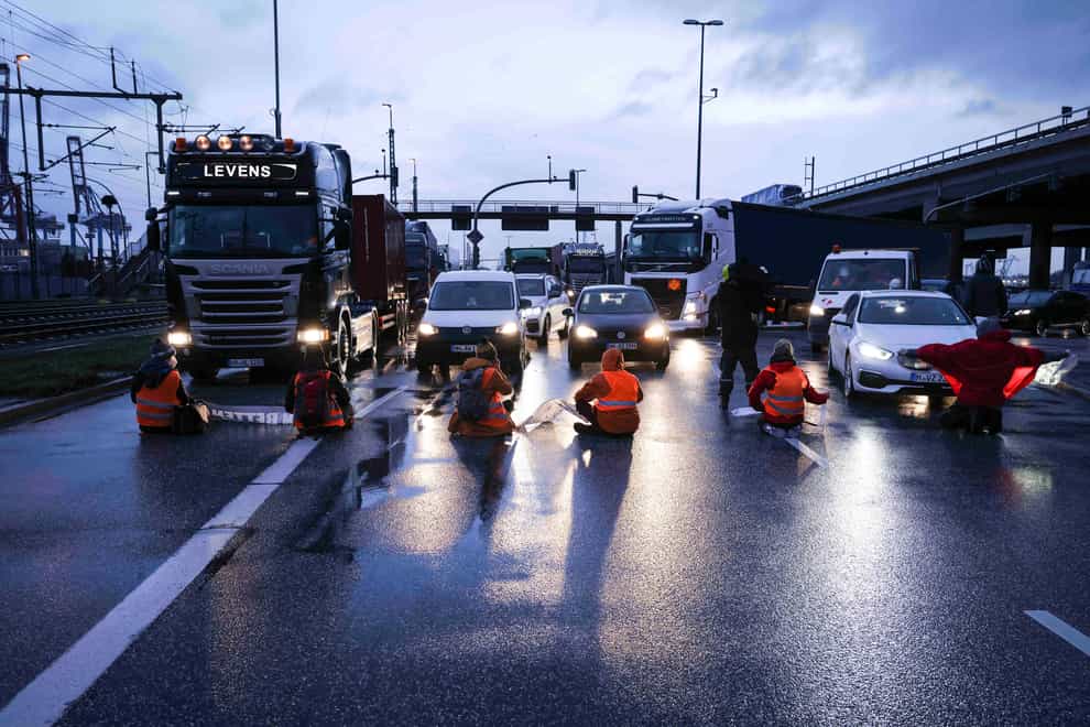 Climate activists block a road in Hamburg, Germany (Christian Charisius/dpa via AP)