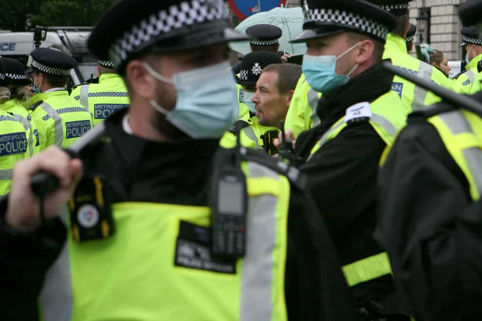 Police officers at an anti-lockdown protest in Parliament Square, London (PA)