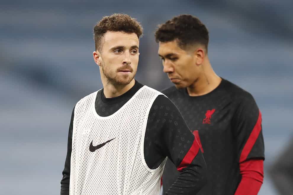 Diogo Jota (left) and Roberto Firmino will miss Liverpool’s match against Leeds (Clive Brunskill/PA)