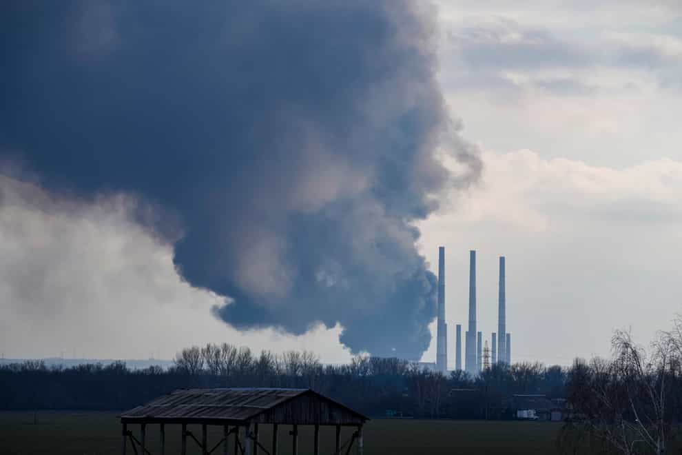 Smoke billows from a power and heating plant after it was shelled in Shchastya, in the Luhansk region, eastern Ukraine (Vadim Ghirda/AP)