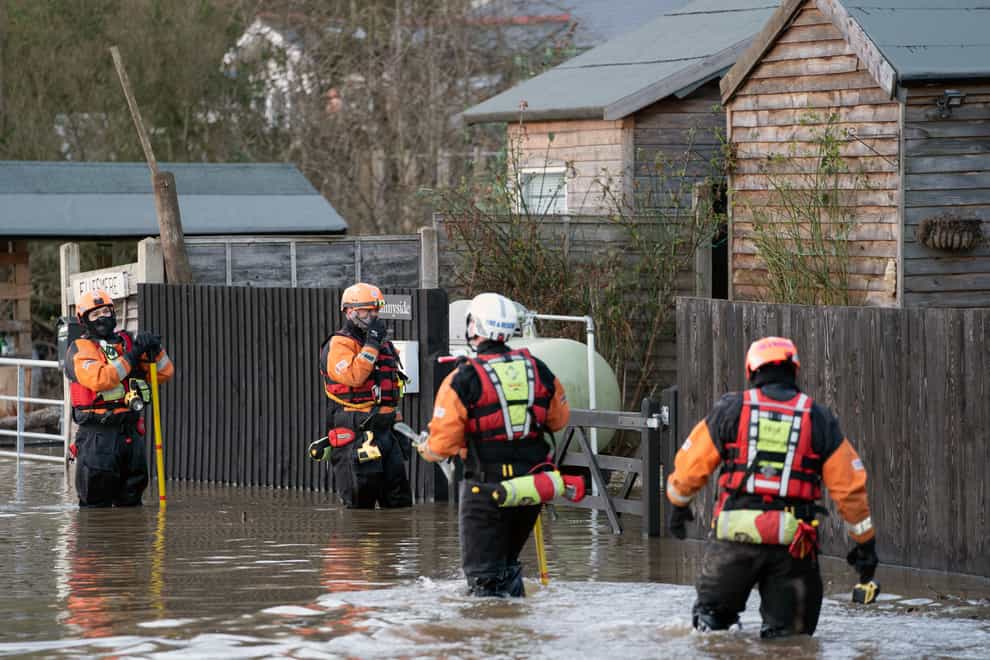 Emergency services check on residents along the River Severn near Bewdley in Worcestershire (PA)