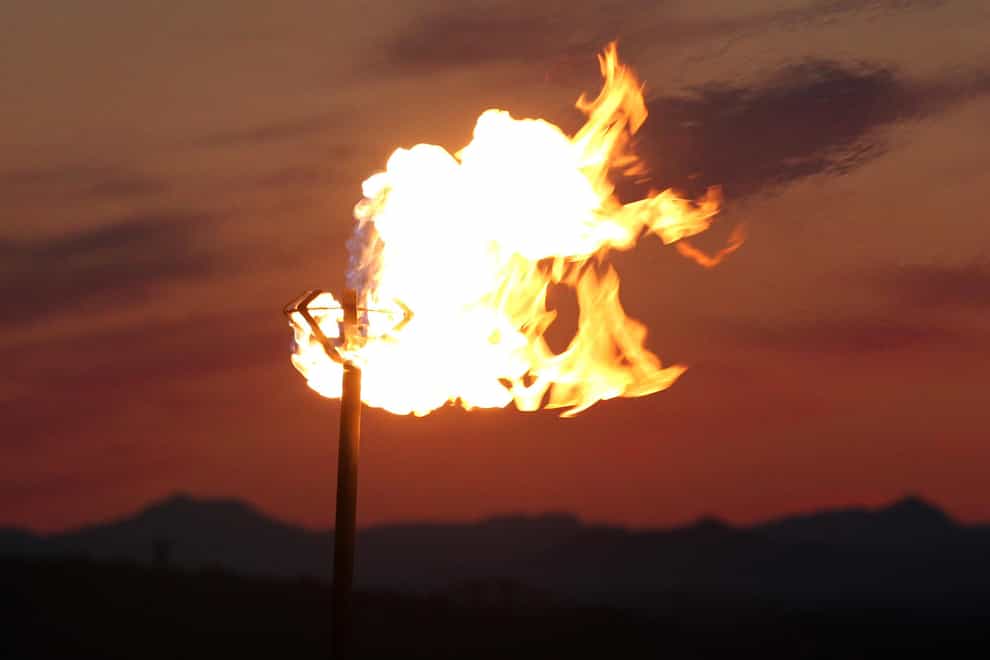 A beacon burns at sunset at Edinburgh Castle (Andrew Milligan/PA)