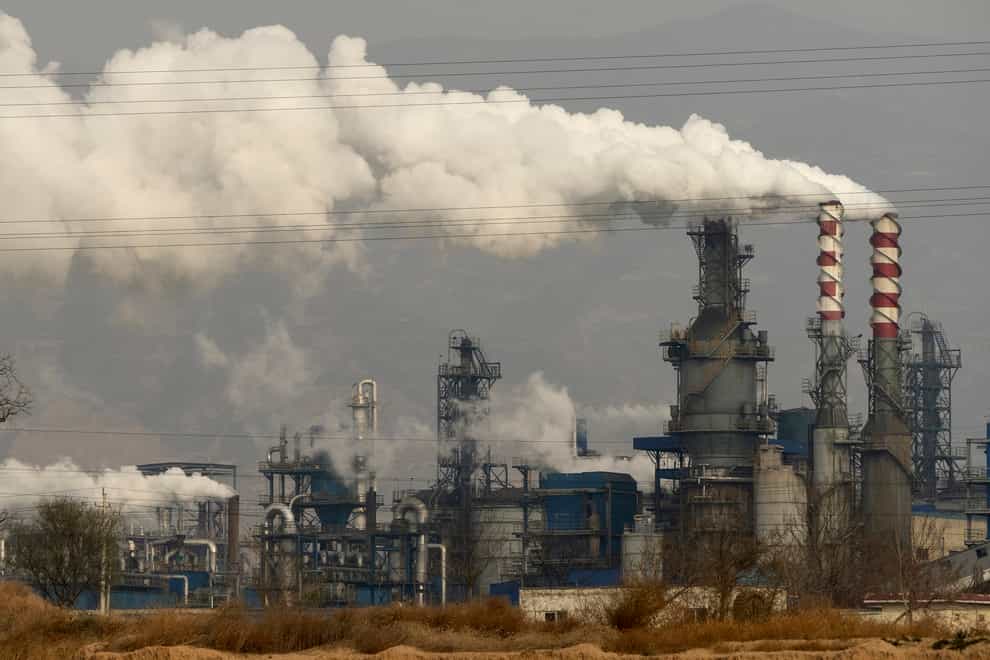 FILE – In this Nov. 28, 2019, file photo, smoke and steam rise from a coal processing plant in Hejin in central China’s Shanxi Province. The International Energy Agency said Wednesday that emissions of planet-warming methane from oil, gas and coal production are significantly higher than governments claims. The countries with the highest emissions are China, Russia, the United States, Iran and India, the IEA said. (AP Photo/Olivia Zhang, File)