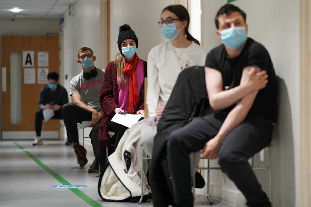 NHS England has said patients, staff and visitors should continue to wear face masks in GP practices (Kirsty O’Connor/PA)