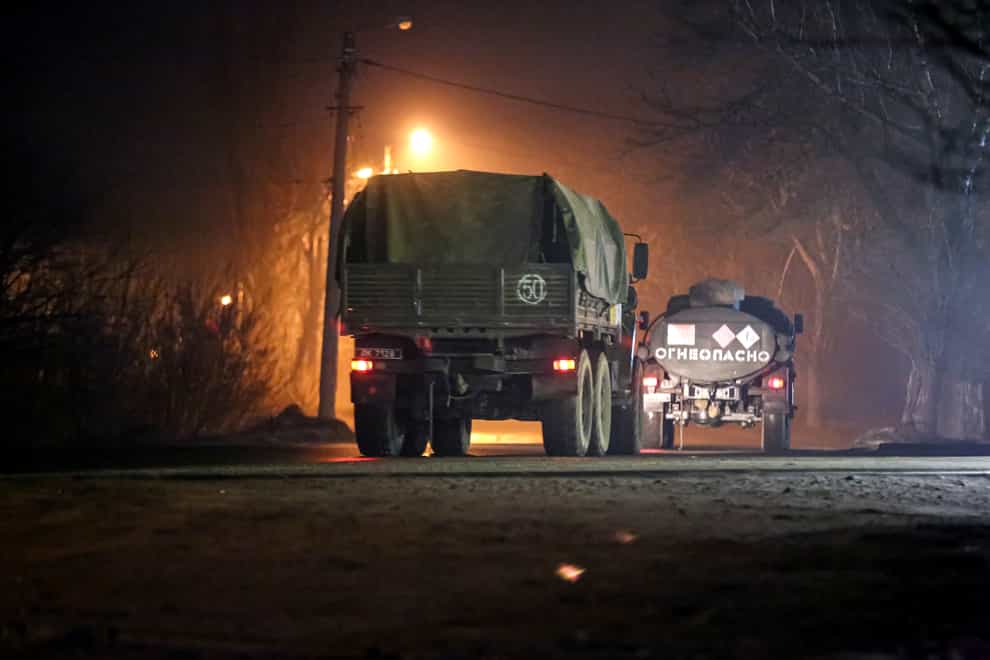 Military lorries move down a street outside Donetsk, the territory controlled by pro-Russian militants, eastern Ukraine (AP)
