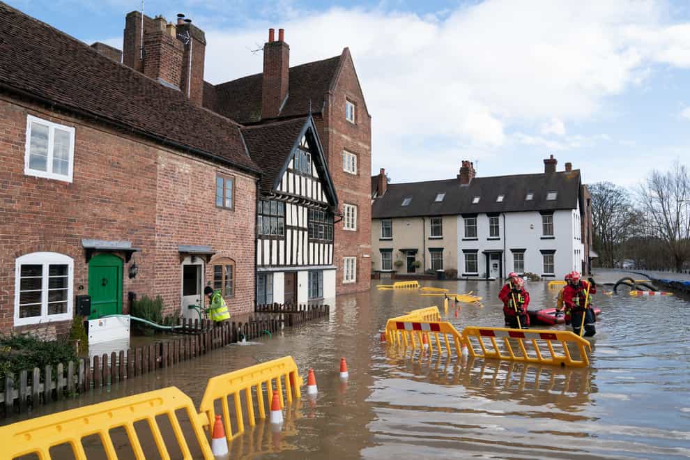Search and rescue teams check on residents in Bewdley, in Worcestershire, where floodwater from the River Severn has breached the town’s flood defences following high rainfall from Storm Franklin (Joe Giddens/PA)