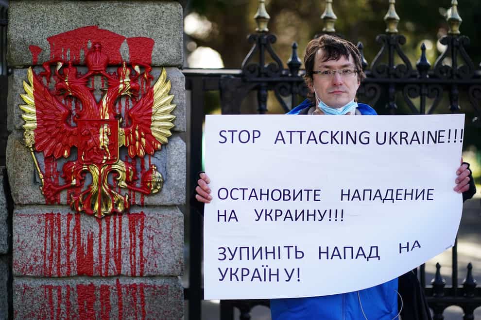 Mykhailo Makarov from Ukraine and living in Dublin protests at the entrance to the Embassy of Russia in Dublin where prior to his arrival red paint was poured on the coat of arms of the Russian Federation following the Russian invasion of Ukraine (Brian Lawless/PA)