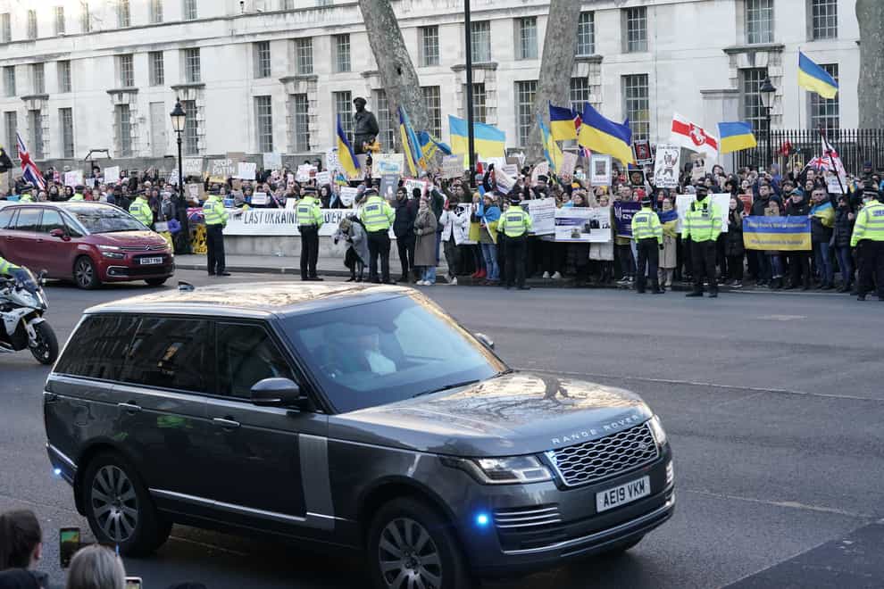 Ukrainians hold a protest against the Russian invasion of Ukraine as Prime Minister Boris Johnson leaves Downing Street to update MPs in the House of Commons on the latest situation regarding Ukraine (PA)