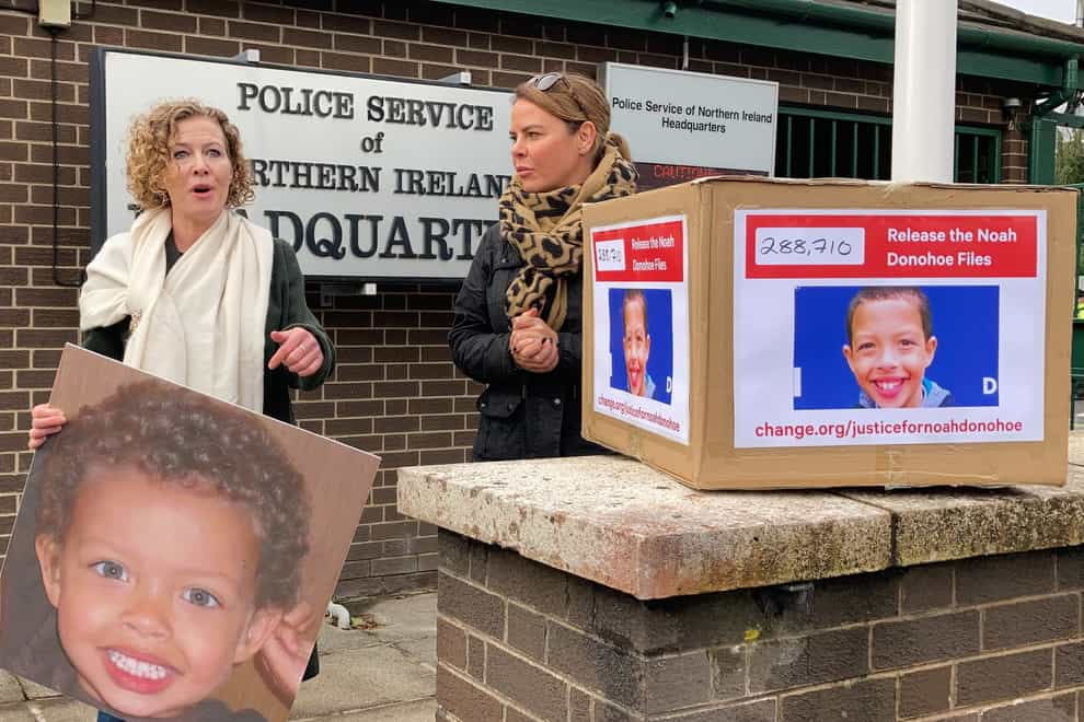 Fiona Donohoe and her sister Niamh protest at PSNI headquarters in Belfast in pursuit of justice following the death of her 14-year-old son Noah (Rebecca Black/PA)