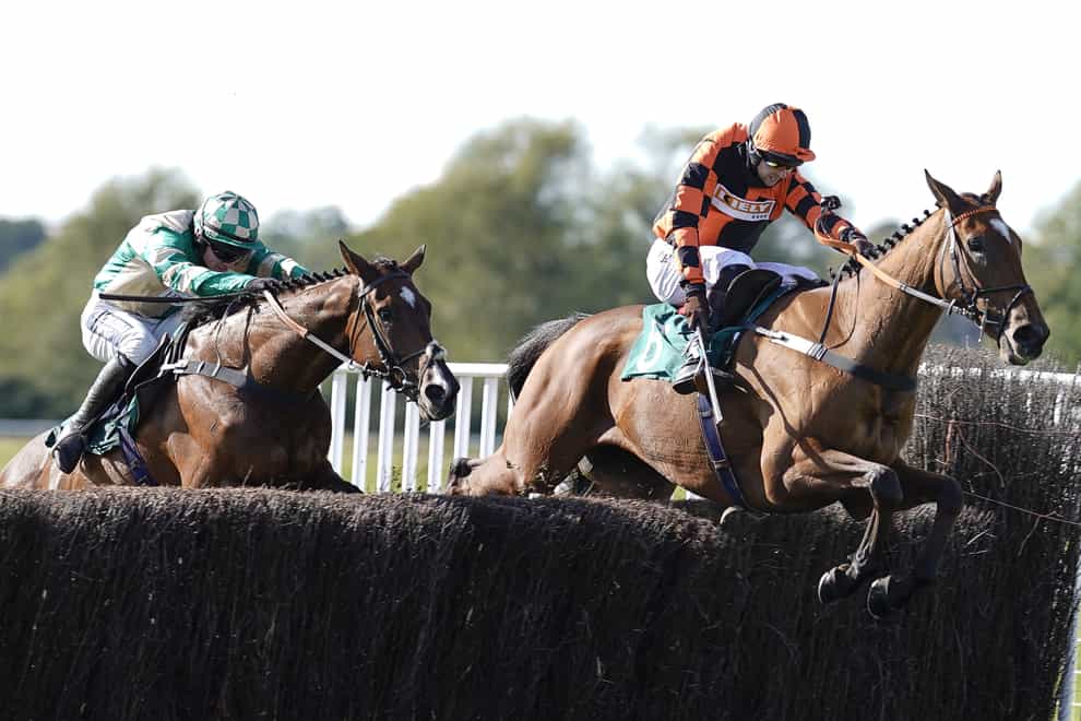 Brendan Powell riding Court Master (R) clear the last to win The Use The racingtv.com Tracker Handicap Chase at Warwick Racecourse, Warwick (Alan Crowhurst/PA)